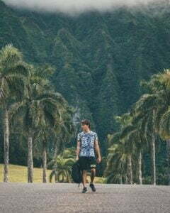 man walking down street in hawaii
