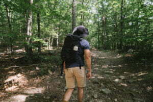 A man hiking through the woods