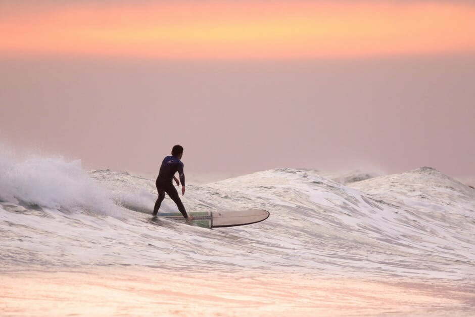 A man surfing on an adventure at the Ohana Hawaii