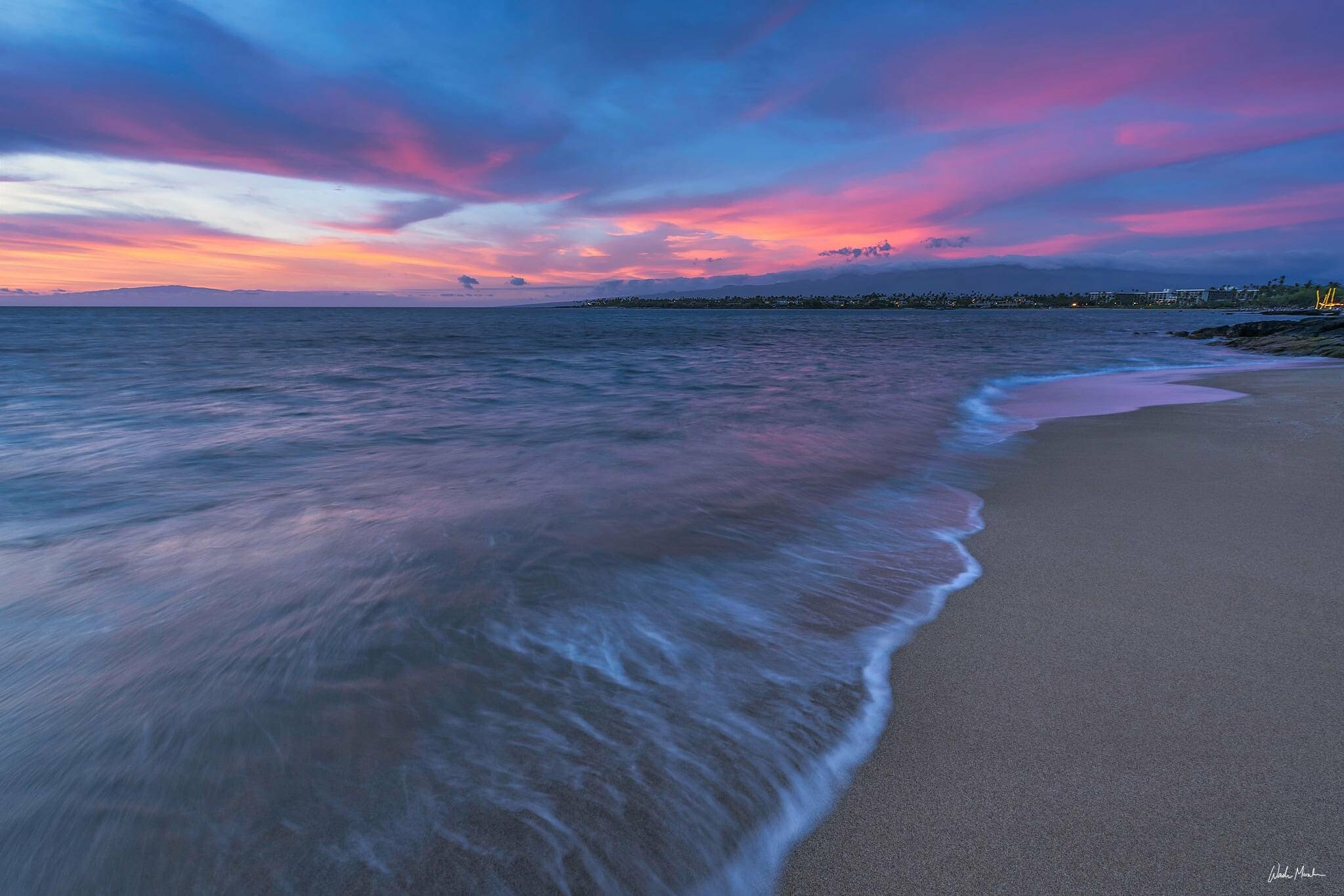 A beautiful blue and pink sunset on a beach in hawaii