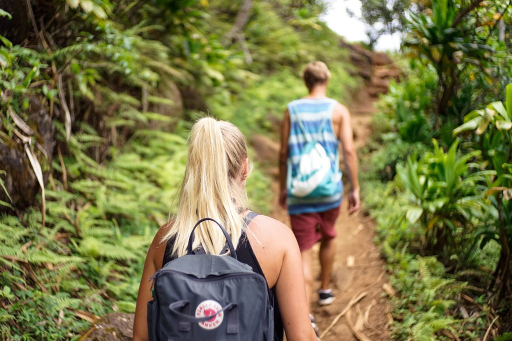 A couple hiking through hawaii