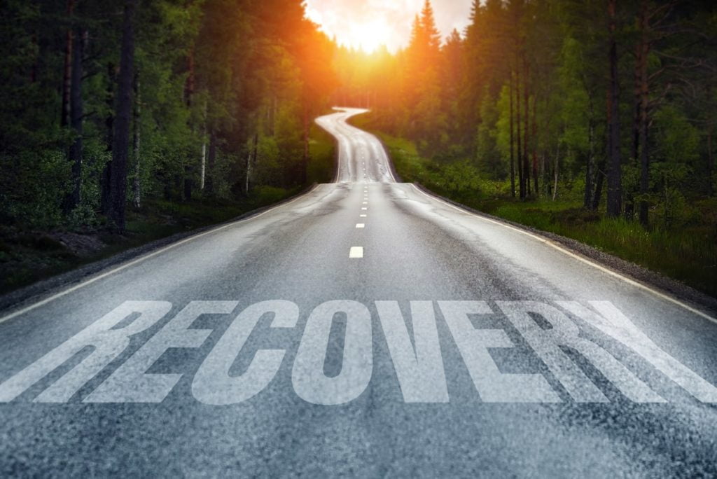 A Long Road With The Words "Recovery" Painted